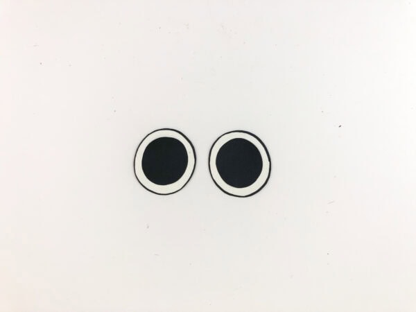 Two completed paper eyes.
