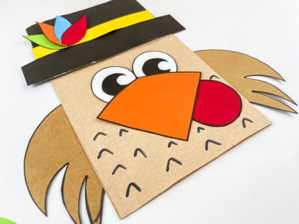 Side view of pilgrim turkey paper bag craft showing layered wings.