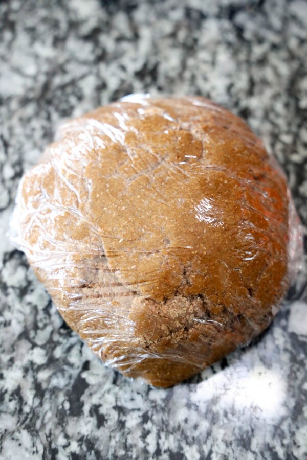 Wrapped gingerbread dough in plastic wrap