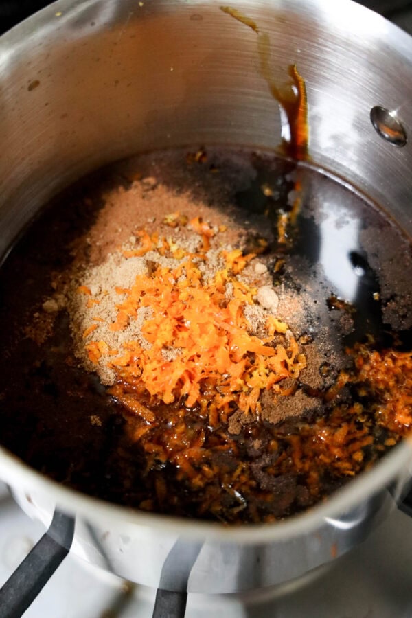 Saucepan with molasses, spices, and orange zest