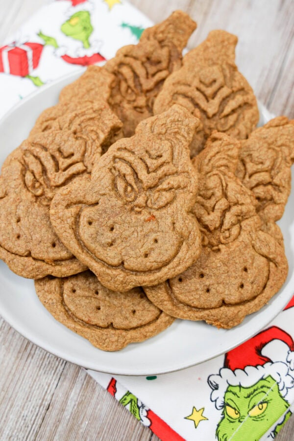 Close-up of Grinch cookies stacked on plate