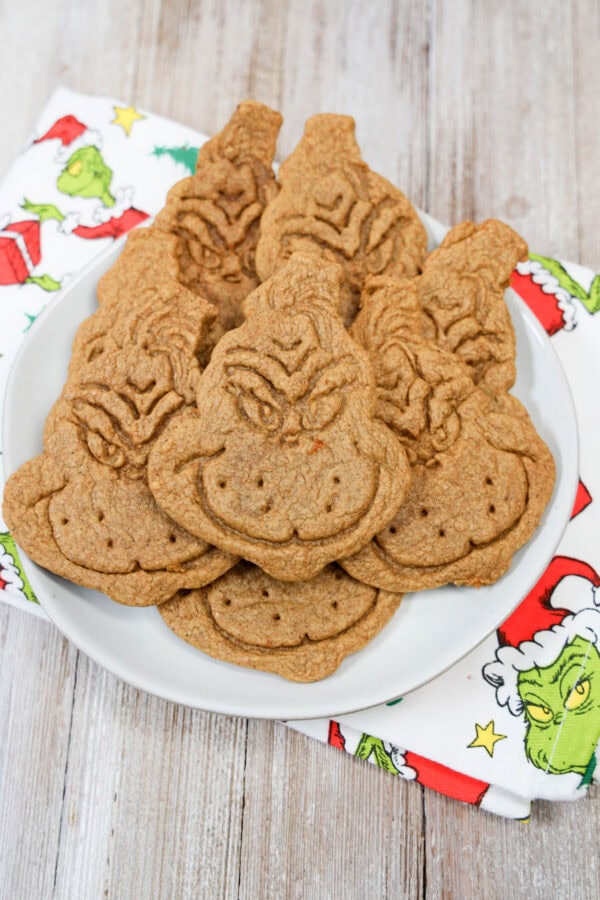 Full plate of Grinch cookies on holiday napkin