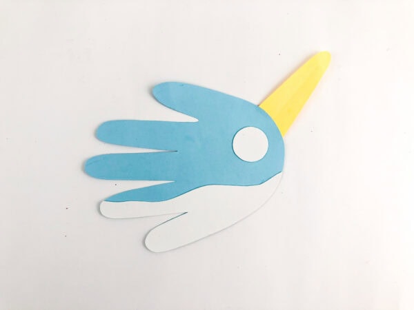 Narwhal body with yellow horn and white eye circle attached.