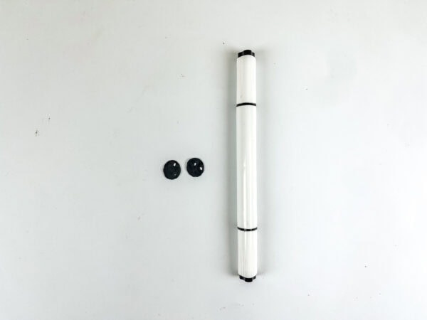 Two black-drawn penguin eyes and a marker.