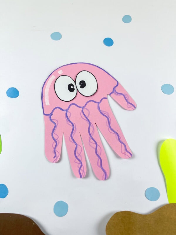 Angled view of jellyfish handprint craft in underwater scene