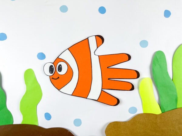 Nemo fish handprint craft swimming scene with sea plants