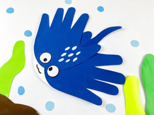 Stingray handprint craft displayed with seaweed background