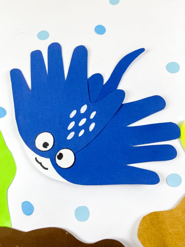 Blue stingray handprint craft on ocean scene