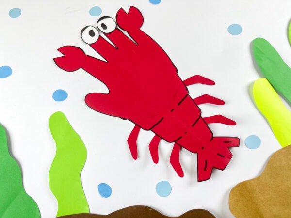 Lobster handprint paper craft with seaweed background