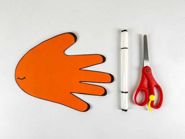 Orange handprint cutout for Nemo fish craft