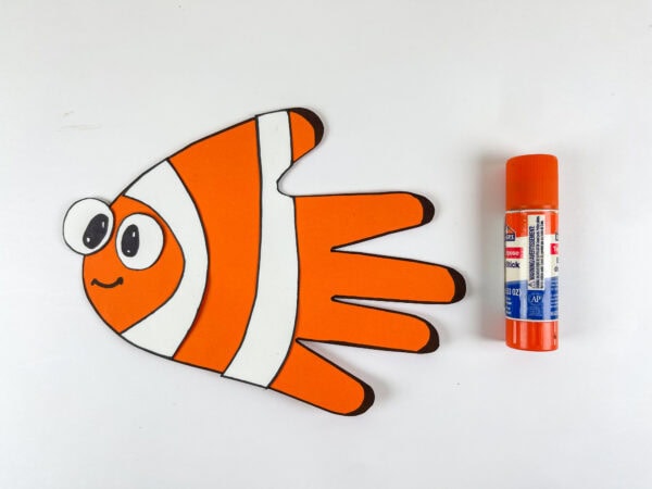 Nemo fish handprint craft with glue stick