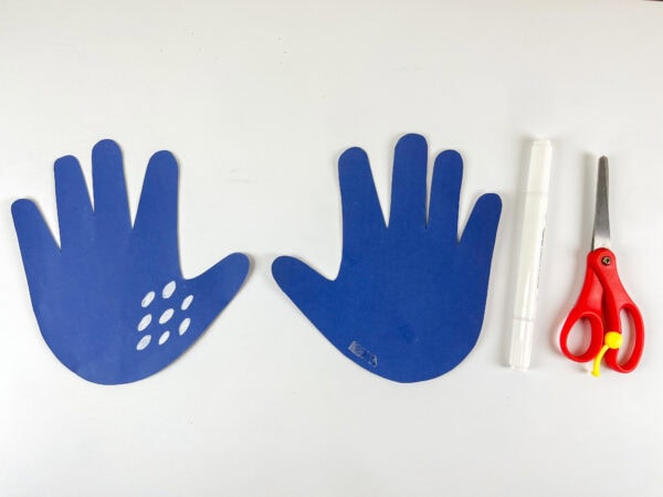 Two blue handprint cutouts for stingray craft