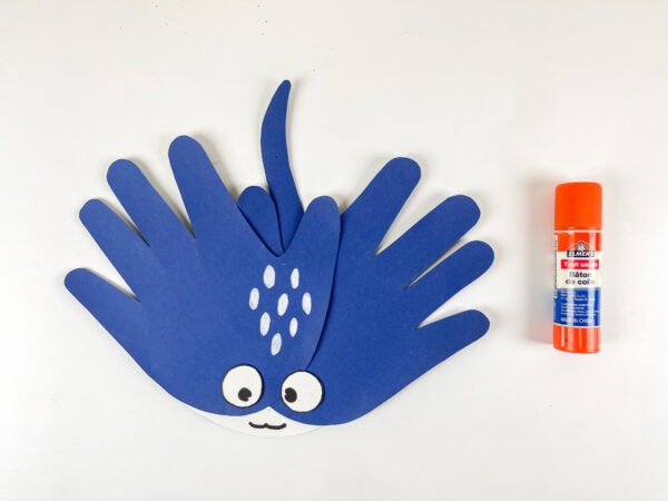 Gluing handprint pieces to form a stingray