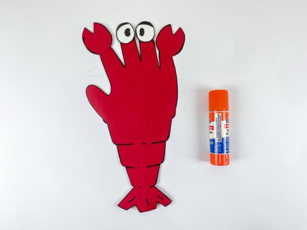 Lobster handprint with eyes and claws attached