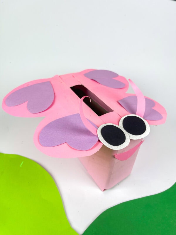 Butterfly Valentine box on white background with green paper