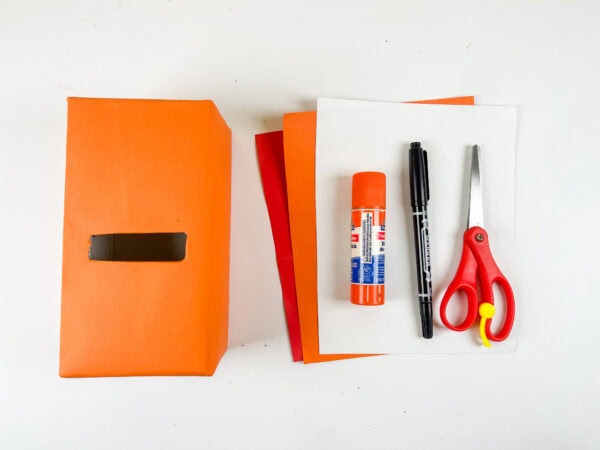 Materials for fox Valentine box craft on table