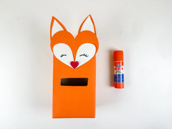 Fox face attached to orange box with card slot