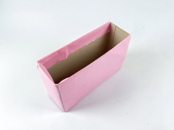 Pink rectangular box covered with paper