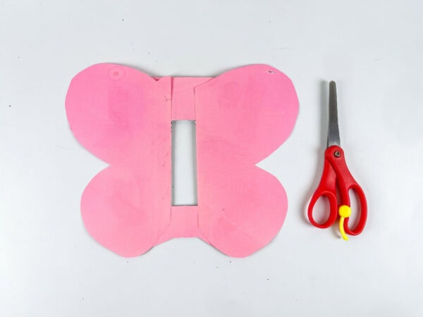 Butterfly wing shape cut from pink paper