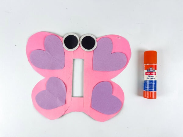 Butterfly craft with eyes attached and heart wings decorated