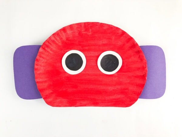 Paper plate robot with glued-on eyes
