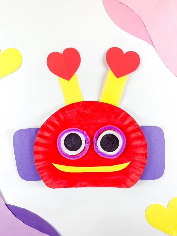 Close-up of robot face with heart antennae