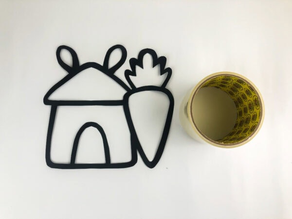 Template outline beside tape roll