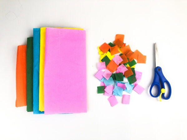 Tissue paper squares with scissors