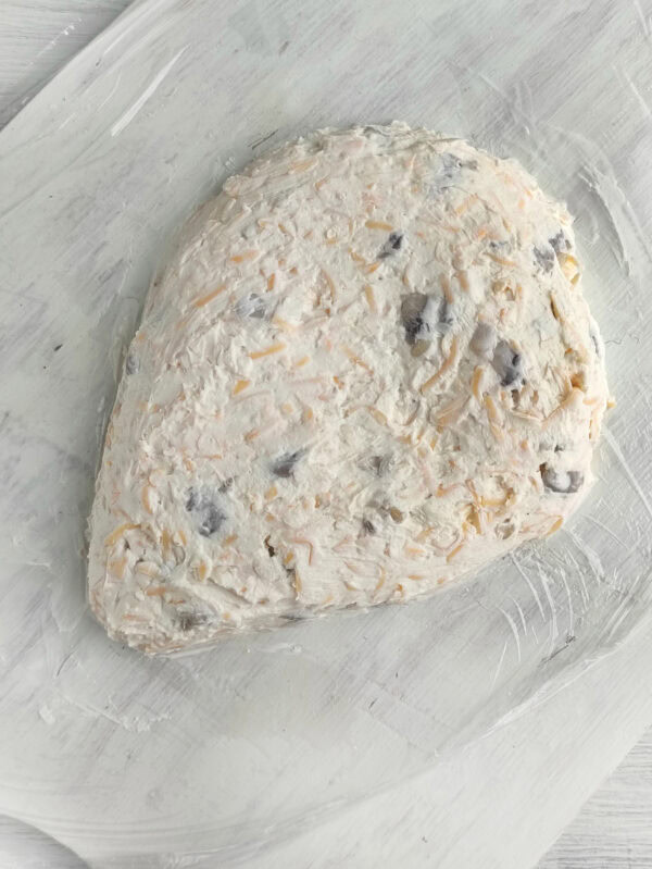 Shaped hedgehog cheese spread formed on parchment paper