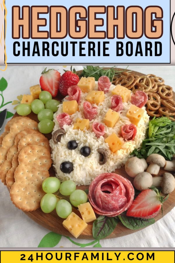 Hedgehog charcuterie board made with cheese spread, salami, grapes, crackers, pretzels, and strawberries