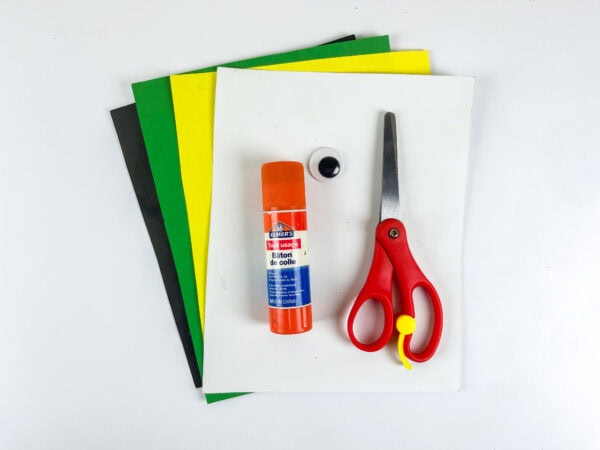 Construction paper, glue stick, scissors, and googly eye supplies