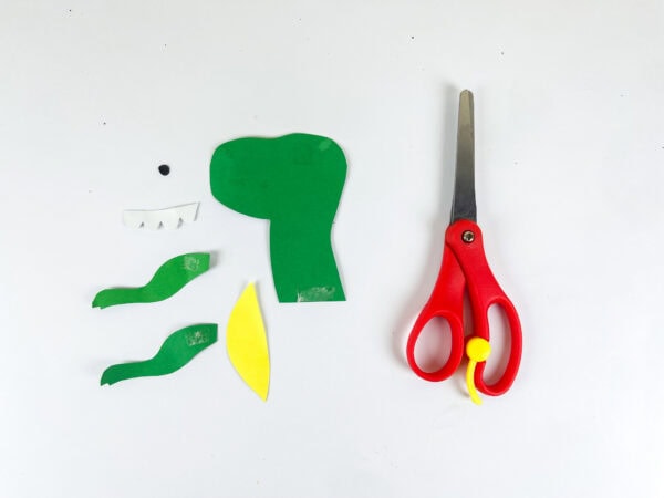Dinosaur craft head, arms, teeth pieces with scissors
