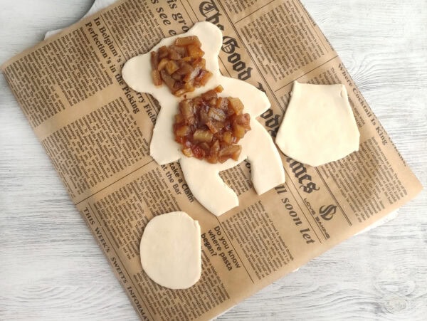 Apple filling placed inside teddy bear dough
