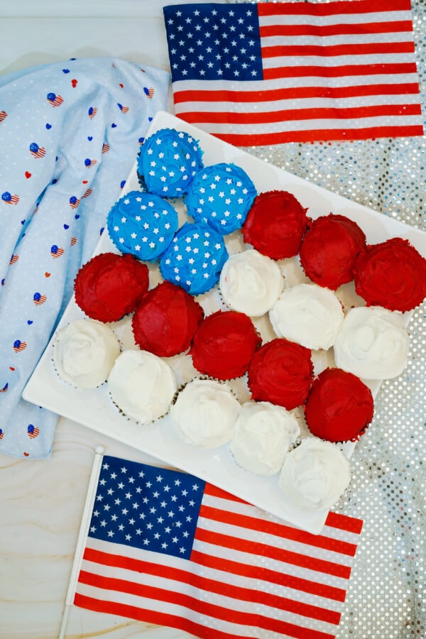 American flag cupcakes on tray with flag decorations