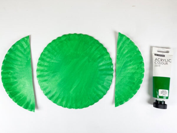 Green painted paper plate and cut ear pieces