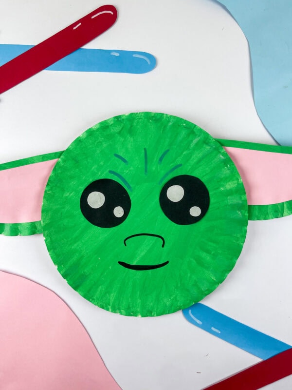 Baby Yoda paper plate craft on colorful background