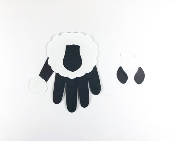 Handprint base with tail and ear pieces nearby