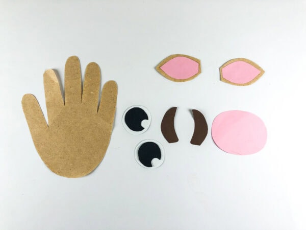 Handprint base with ears eyes horns and nose pieces prepared