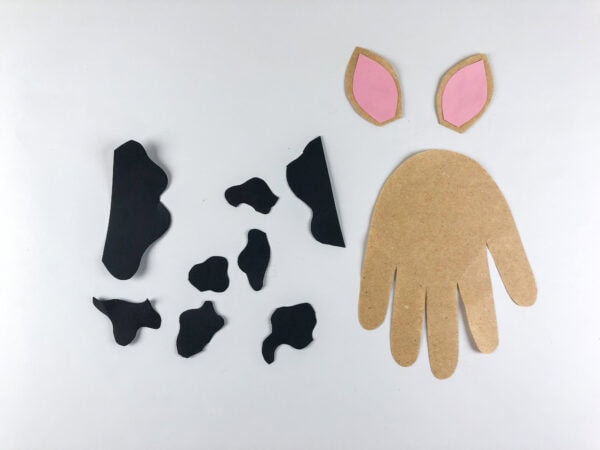 Handprint base with ears and black spots ready for assembly