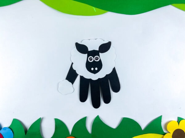Goat handprint craft on decorative paper background