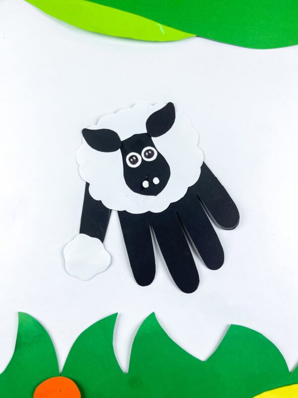 Goat handprint craft on colorful paper background