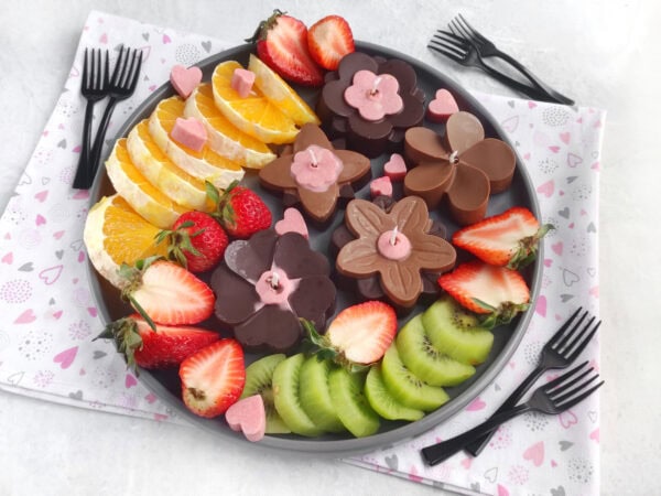 Fruit platter with chocolate flower candles and heart candies