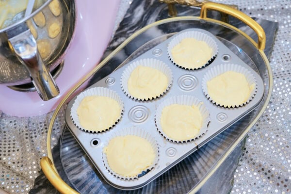Cupcake batter poured into lined muffin pan