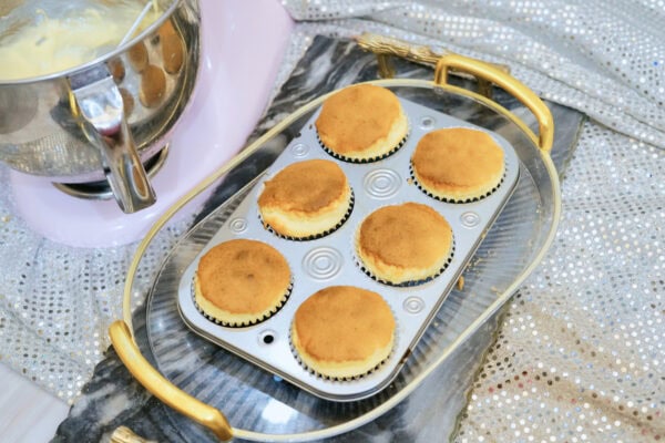 Freshly baked plain cupcakes in muffin pan