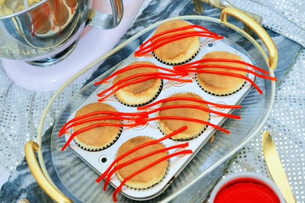 Twizzlers licorice strips placed on cupcakes for crab legs