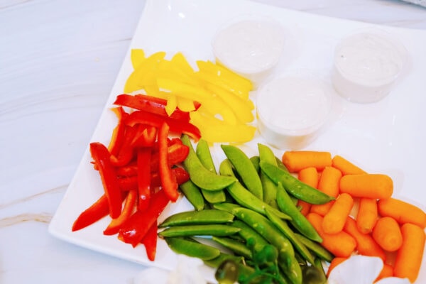 Sliced peppers, snap peas, and baby carrots