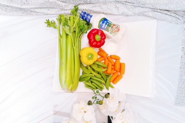 Vegetables and dip ingredients on white tray