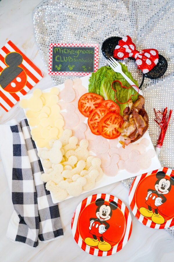 Mickey sandwich ingredients arranged on themed serving board