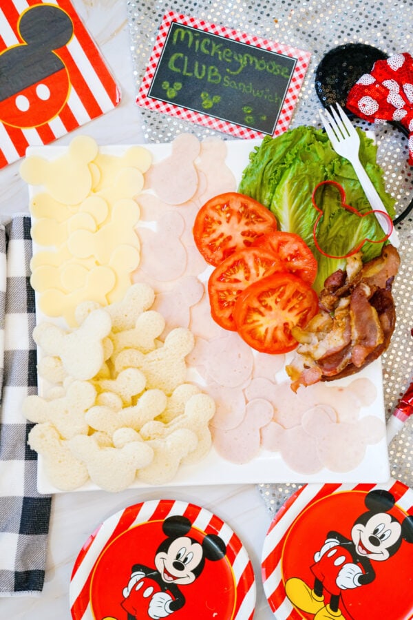 Close view of Mickey sandwich board with tomatoes and lettuce