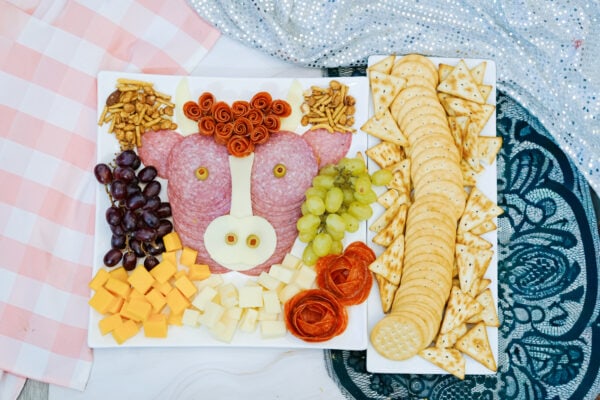 Full highland cow charcuterie board on a white platter